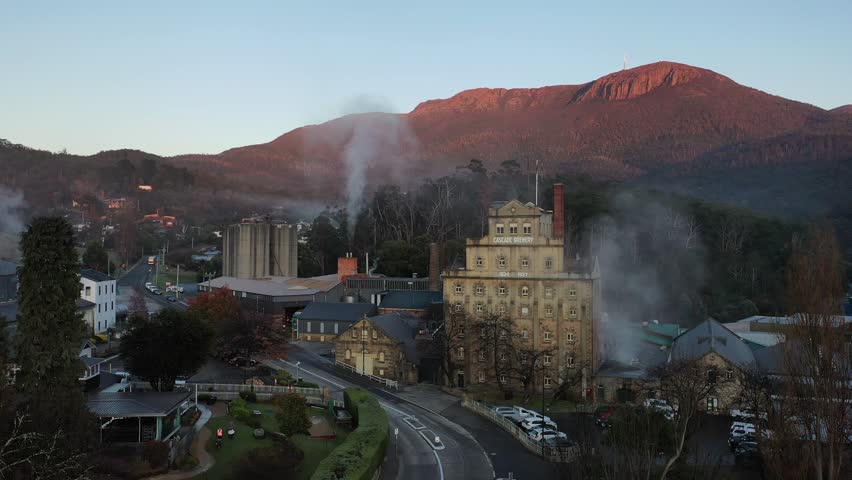 Sunrise over Cascade Brewery Mt Wellington Kunanyi, Tasmania, Australia Aerial Drone 4K
