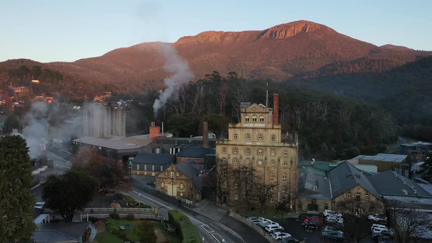 Sunrise over Cascade Brewery Mt Wellington Kunanyi, Tasmania, Australia Aerial Drone 4K