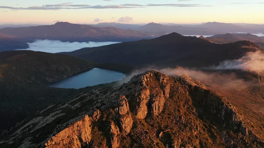 Sunrise Golden Light Fog Mist Hartz Peak, Tasmania, Australia Aerial Drone 4K