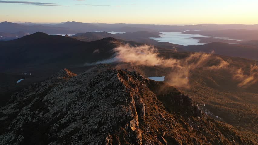 Sunrise Golden Light Fog Mist Hartz Peak, Tasmania, Australia Aerial Drone 4K