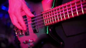 Rock Band Performing at a Concert in a stage. Close Up Shot of a Guitar Played by a Musician.  - Powered by Shutterstock - Get 15% off with code: PIKWIZARD15