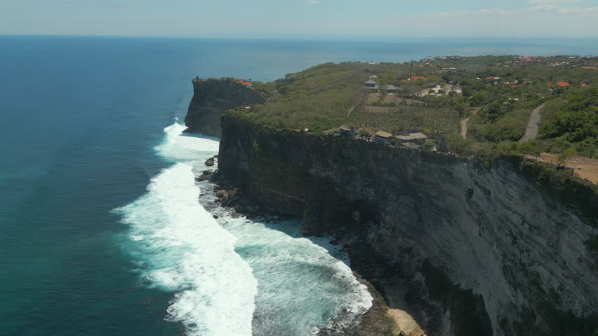 Luxury Resort With Epic View On Uluwatu Cliff Edge Bali Indonesia Drone Track Back Pan 4K 60FPS