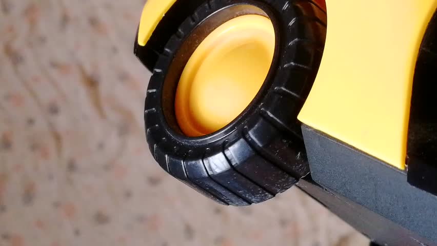 Car wheel spinning. Black tire with yellow rim rolling slowly. Best intro clip for racing, car presentation, branding, rally competition etc