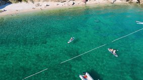 Beautiful Young Woman in Bikini Stand Up Paddling Sup Surfing in Stara Baska Skrila Beach Krk Island, Croatia. Mediterranean Summer. Aerial Shot From Above. Blue Sea the Rocks Mountains and Coastline - Powered by Shutterstock - Get 15% off with code: PIKWIZARD15