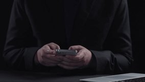 A person interacts with a smartphone displaying data visualizations and analytics. The image captures modern technology in a sleek workspace, emphasizing connectivity and insight. Qubit - Powered by Shutterstock - Get 15% off with code: PIKWIZARD15