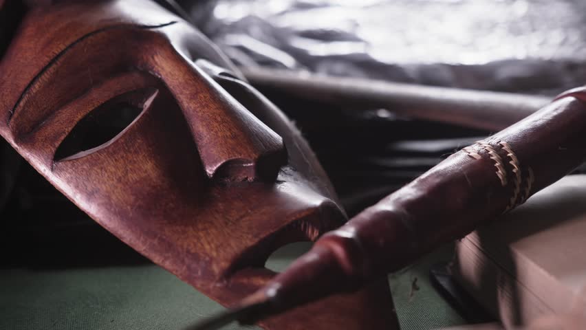 African wood carved tribal Ceremonial Masks Close-Up Slide reveal Shot