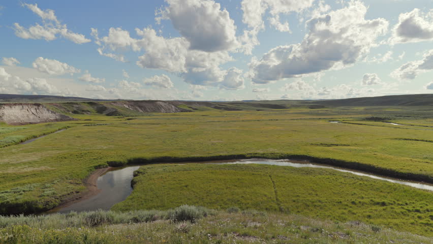 Explore the stunning landscapes of Lamar Valley in Yellowstone National Park, Wyoming. Lush fields and open skies invite you to discover scenic details and hidden gems in this outdoor paradise