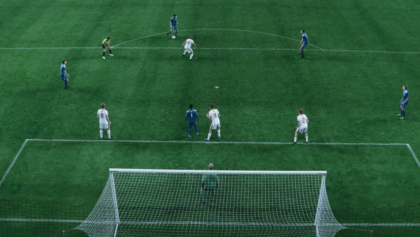 Soccer Championship: Blue Team Forward Attacks and Scores Goal, Football Players Celebrate Victory, Win Major League Cup. Sport Channel Broadcast Television Playback. High Angle Footage Over the Gate