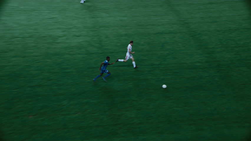 Black Soccer Player Running with the Ball, Attacking the Gate but Goalkeeper Catching the Ball. International Football Night Championship. Sport Broadcast Channel Television Playback