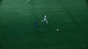 Black Soccer Player Running with the Ball, Attacking the Gate but Goalkeeper Catching the Ball. International Football Night Championship. Sport Broadcast Channel Television Playback - Powered by Shutterstock - Get 15% off with code: PIKWIZARD15