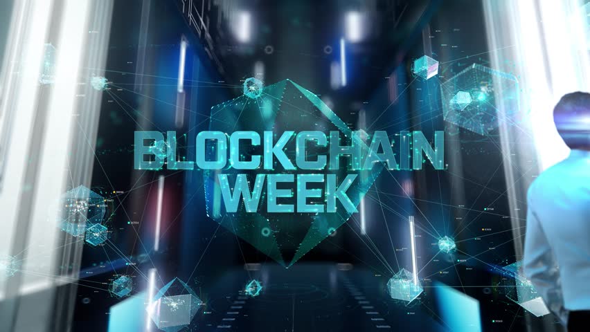 Blockchain week. Man in Futuristic Office Interior Moving and Activating Hologram.