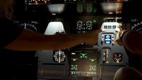 Pilot giving instructions to co-pilot about controls and instruments at cockpit of Airbus A320 prior to flying. - Powered by Shutterstock - Get 15% off with code: PIKWIZARD15