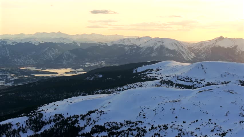 Loveland Pass aerial drone Coon Hill Colorado Continental Divide Rocky Mountains Summit County Lake Dillon Buffalo Mountain golden hour vibrant sunset winter spring Silverthorne circle left motion