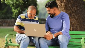 indian father and son using laptop  - Powered by Shutterstock - Get 15% off with code: PIKWIZARD15