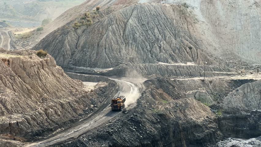 Large mining dump trucks, also known as haul truck going into the coal mine in india