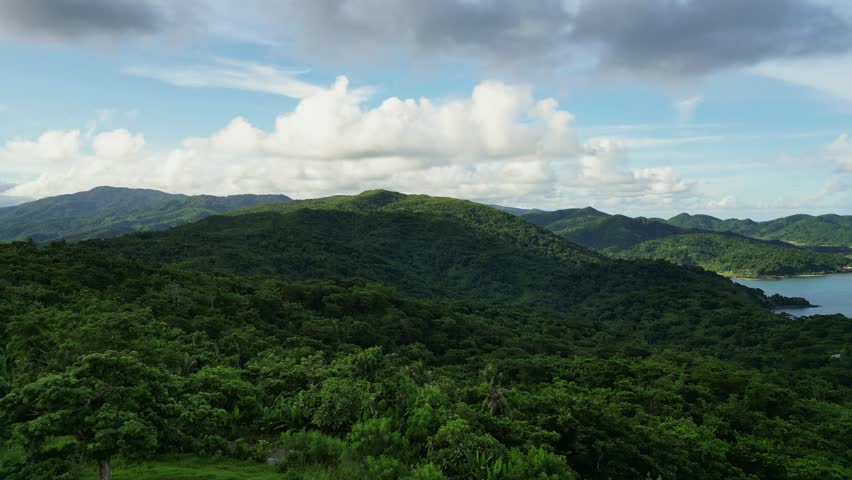 Mountain Range Covered With Lush Green Forest In The Philippines. - aerial shot