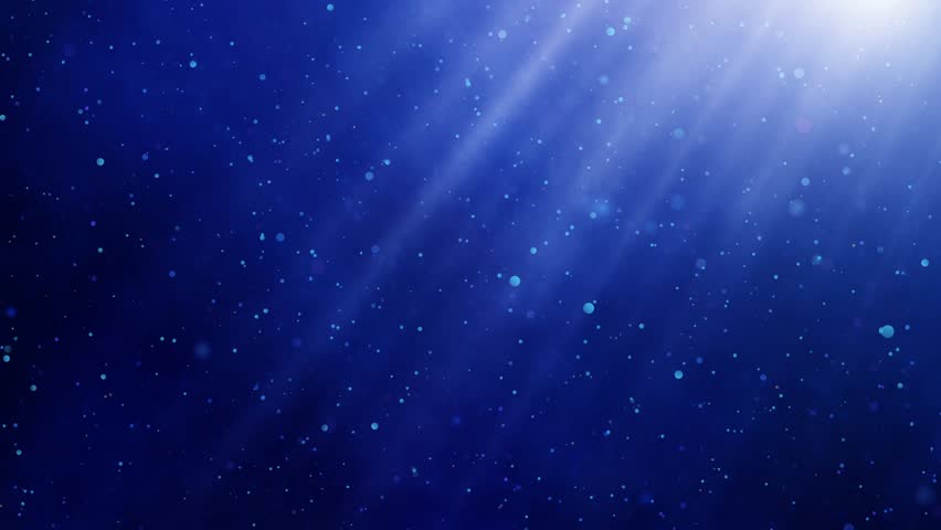 Blue smoke and light rays - loopable slow motion whirling particles in a soft and serene abstract atmosphere