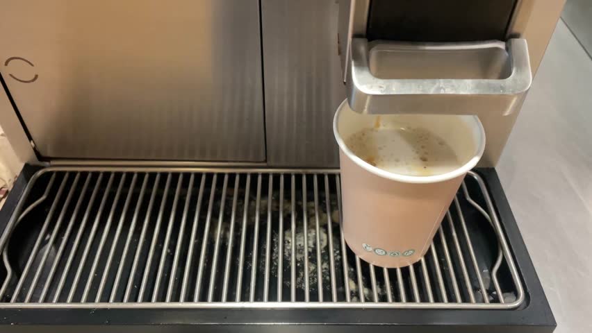 Automatic Coffee Machine Pouring Fresh Cup of Latte in Paper Cup