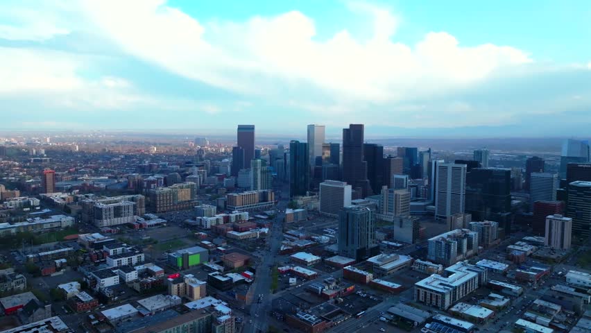 Downtown Denver Rhino art district spring summer after rain thunderstorm aerial drone Colorado cityscape landscape buildings sunny blue skies cloudy afternoon cars traffic upwards motion