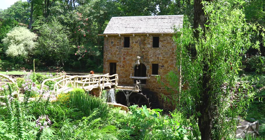 Static video of the Old Mill in Little Rock Arkansas. Medium shot showing building and waterwhell.