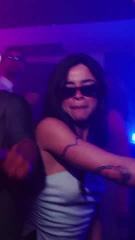 Women dancing at nightclub in slow motion