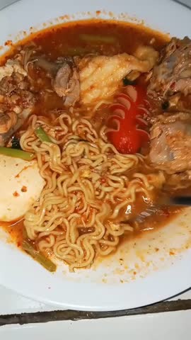delicious chicken noodles with complete toppings and delicious sausages 