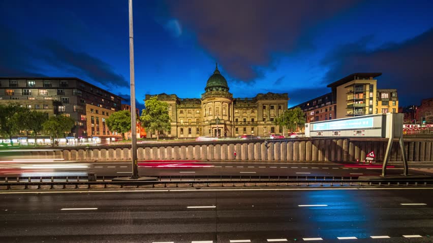 4K Footage Time lapse Long exposure of Crowded Traffic and transportation on Mitchell Library public library at twilight time, Edinburgh, Scotland, United Kingdom