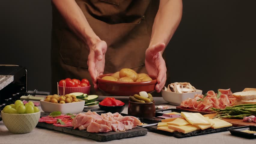 Italian or Spanish restaurant with traditional tapas food, Spanish cuisine, delicious tapas and cheese plate, bruschetta with cheese, olives dry tomatoes and tasty sandwich bar appetizer, buffet