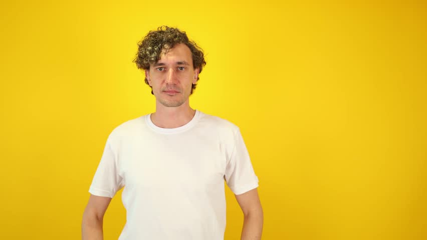 Excited man in white t-shirt mimicking a spyglass with hands, then lowering them and exclaiming WOW — a dynamic visual perfect for Black Friday, Cyber Monday, and seasonal sales campaigns