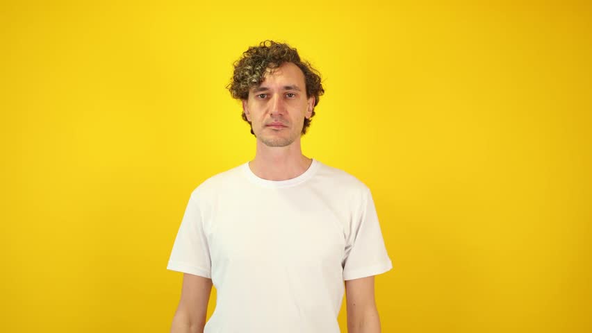 Excited man in white t-shirt mimicking a spyglass with hands, then lowering them and exclaiming WOW — a dynamic visual perfect for Black Friday, Cyber Monday, and seasonal sales campaigns