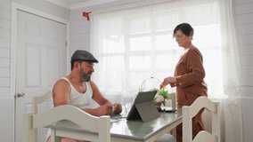 Senior hispanic couple organizing home finances together at kitchen table - Powered by Shutterstock - Get 15% off with code: PIKWIZARD15