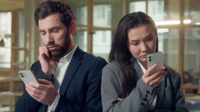 Multiethnic team Korean businesswoman glance at Caucasian businessman mobile phone expression business smartphone comparison play game success jealousy cellphone device office work application online - Powered by Shutterstock - Get 15% off with code: PIKWIZARD15