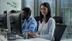 Helpline callcenter multiethnic business workers working online computer office customer service call center diverse smiling Caucasian Indian women African man in headset speak work pc helping client - Powered by Shutterstock - Get 15% off with code: PIKWIZARD15
