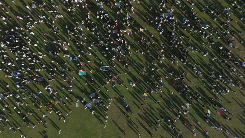 Eid al-Adha Departure Bali.
Aerial view of a large gathering of Muslim people departing the field after morning Eid al-Adha prayer in Bali.
