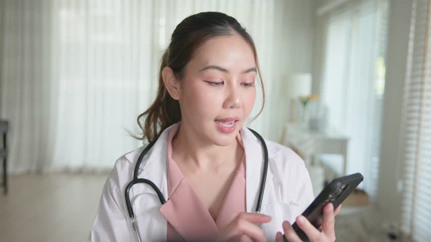 Young adult woman Gen Z asia people anti aging expert modern nurse live talk viral video selfie camera on mobile phone app mental health care. Online sharing digital virtual asian vlogger filming.