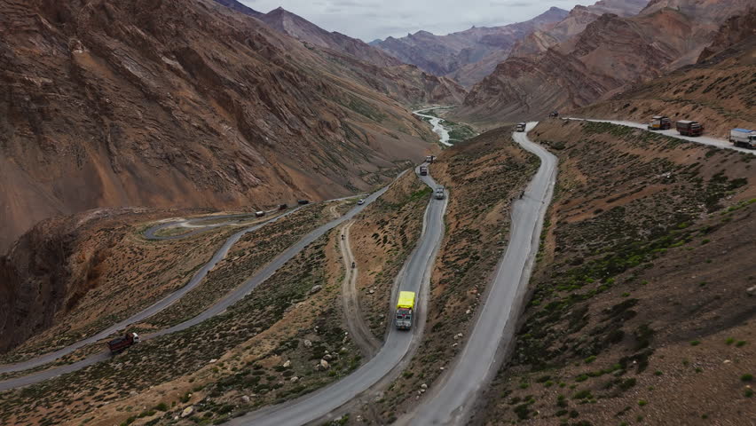 Trucks on Winding Mountain Road in Spiti Valley Drone View