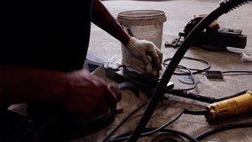 Sparks flying from metal welding work by industrial technician. Close-up of hand with welding torch. Manufacturing plant, fabrication industry, construction welding, steel work, skilled tradesman conc - Powered by Shutterstock - Get 15% off with code: PIKWIZARD15