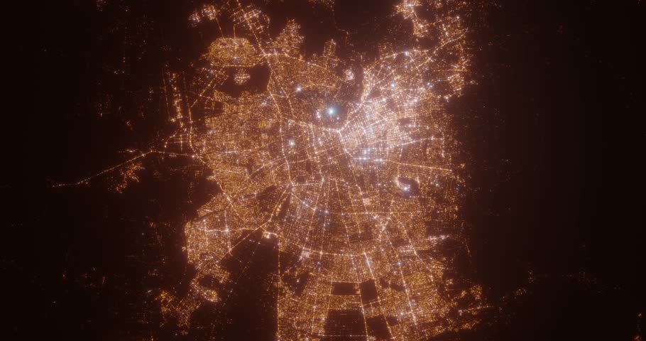 Santiago (Chile) aerial view at night. Top view on modern city with glow effect. Camera is zooming out, rotating counterclockwise