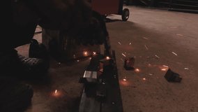 Close-up of welder working with metal, producing sparks during welding process in industrial workshop. Concept of metal fabrication, factory manufacturing, industrial labor, safety equipment, welding  - Powered by Shutterstock - Get 15% off with code: PIKWIZARD15