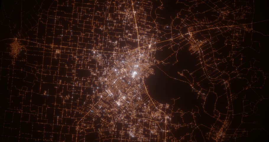Lafayette (Louisiana, USA) aerial view at night. Top view on city from space. Camera is zooming in, rotating clockwise