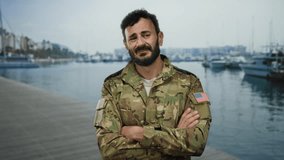 Military man with beard in uniform stands at a bustling port with ships and boats in the background, showcasing a patriotic american flag patch. - Powered by Shutterstock - Get 15% off with code: PIKWIZARD15