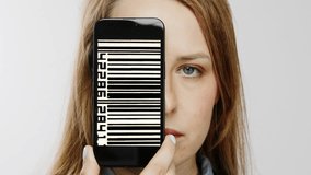 Female head holding smartphone in front of face with glitching video of bar codes on screen - Powered by Shutterstock - Get 15% off with code: PIKWIZARD15