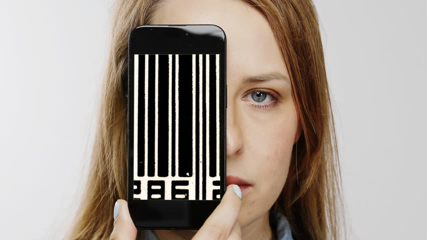 Female head holding smartphone in front of face with glitching video of bar codes on screen - Powered by Shutterstock - Get 15% off with code: PIKWIZARD15