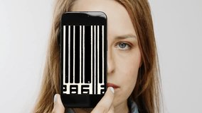 Female head holding smartphone in front of face with glitching video of bar codes on screen - Powered by Shutterstock - Get 15% off with code: PIKWIZARD15