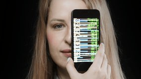Female head holding smartphone in front of face with glitching video of bar codes on screen - Powered by Shutterstock - Get 15% off with code: PIKWIZARD15