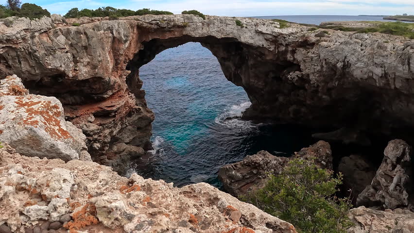 Natural rocky bridge in Cala Varques, in the West side of Mallorca Island, Spain.