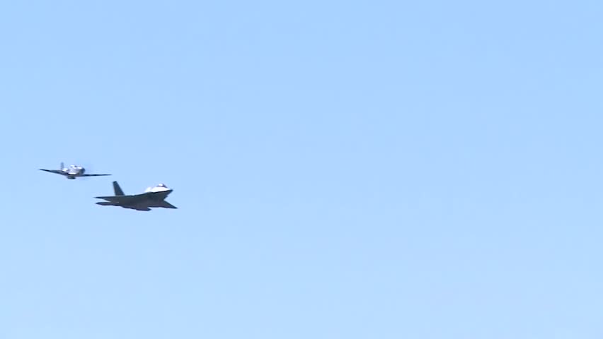 air show between the F-22 Raptor fighter jet and the P-51 Mustang