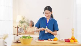 Female caregiver take care and preparing healthy food organic fresh fruit apple serving to senior woman at nursing home. Elderly people health, home medical wellness healthcare rehabilitation services - Powered by Shutterstock - Get 15% off with code: PIKWIZARD15