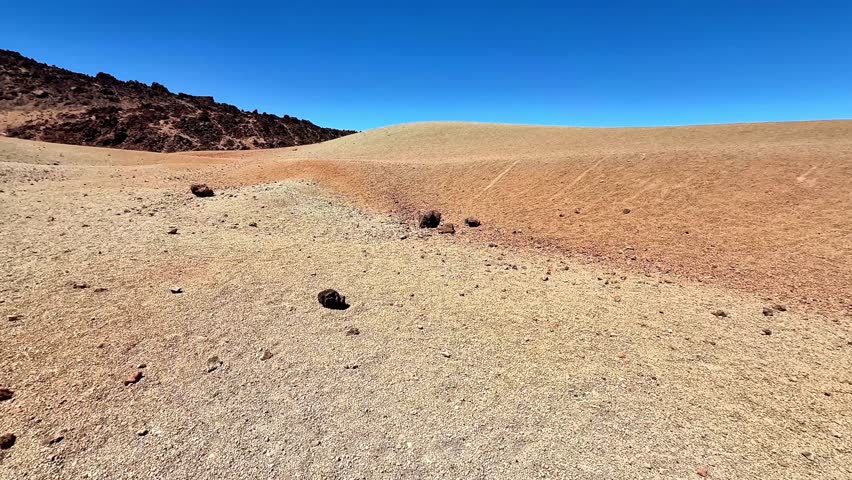 A breathtaking desert scene showcasing unique rock formations and expansive dry land under a vibrant sky.