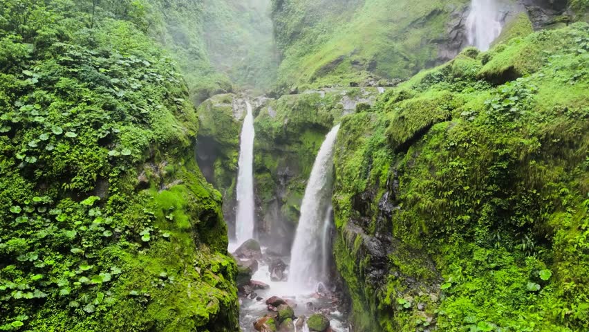 Triple Waterfall Cascading Through Lush Green Canyon | Majestic Aerial Nature Shot